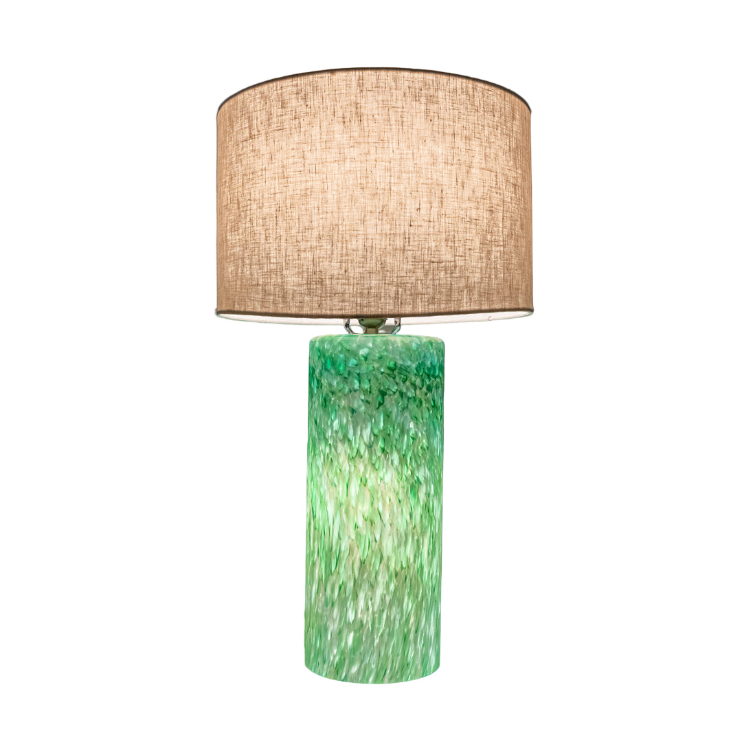 Wimberley Glassworks 3-way Lighted Glass Base Cylinder Table Lamp with Fabric Shade and Monet green on white glass pattern ambient 