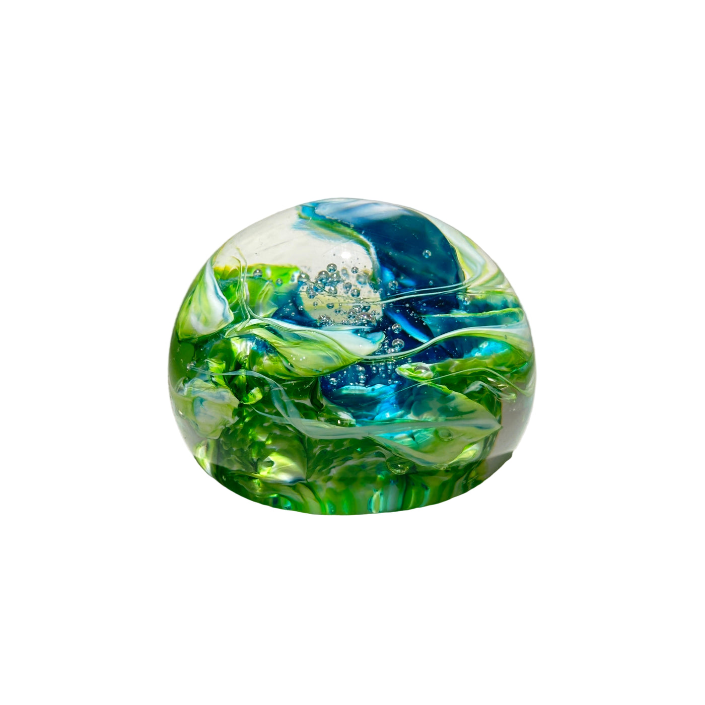 Glass marble with blue and green swirls on a neutral background