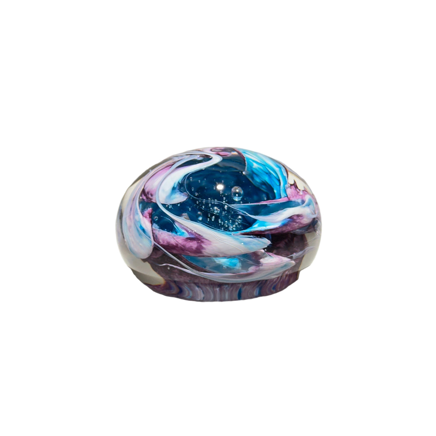 Colorful glass paperweight with swirl pattern on a white background