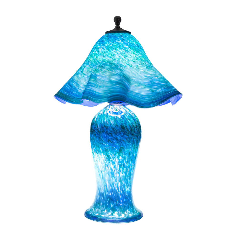 Wimberley Glassworks Handblown Blue glass table lamp with lighted base and  textured design 