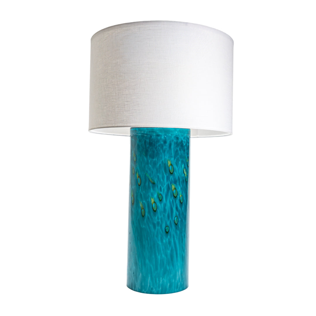 Wimberley Glassworks 3-way Lighted Glass Base Cylinder Table Lamp with Fabric Shade and Emerald Ocean teal blue and ochre yellow accent glass turned off