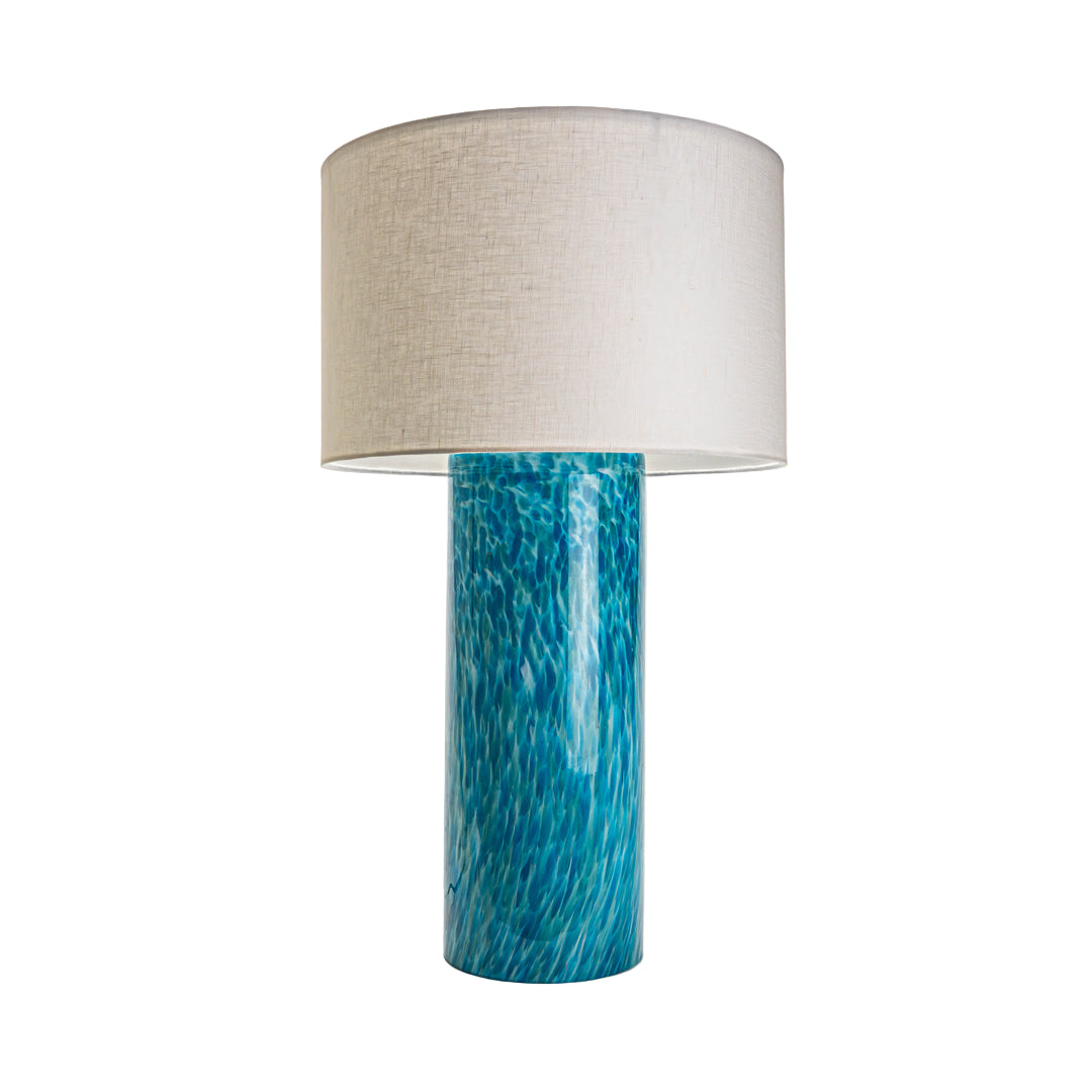 Wimberley Glassworks 3-way Lighted Glass Base Cylinder Table Lamp with Fabric Shade and Monet aqua blue on white glass turned off